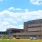 a large building with a parking lot