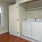 a kitchen with white cabinets
