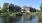 a row of houses next to a river