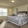 a bedroom with a bed and lamps