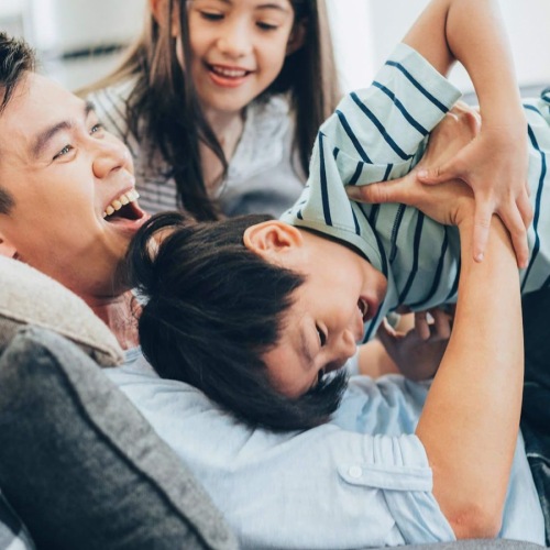 A perfect fit for the whole family a family embracing in a bright room