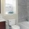 a bathroom with a tub toilet and sink