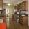 a kitchen with wooden cabinets
